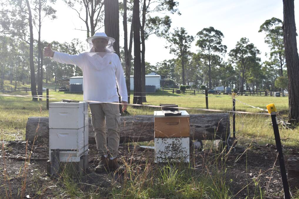 John Bradshaw and his two bee hives. Picture by Angus Michie