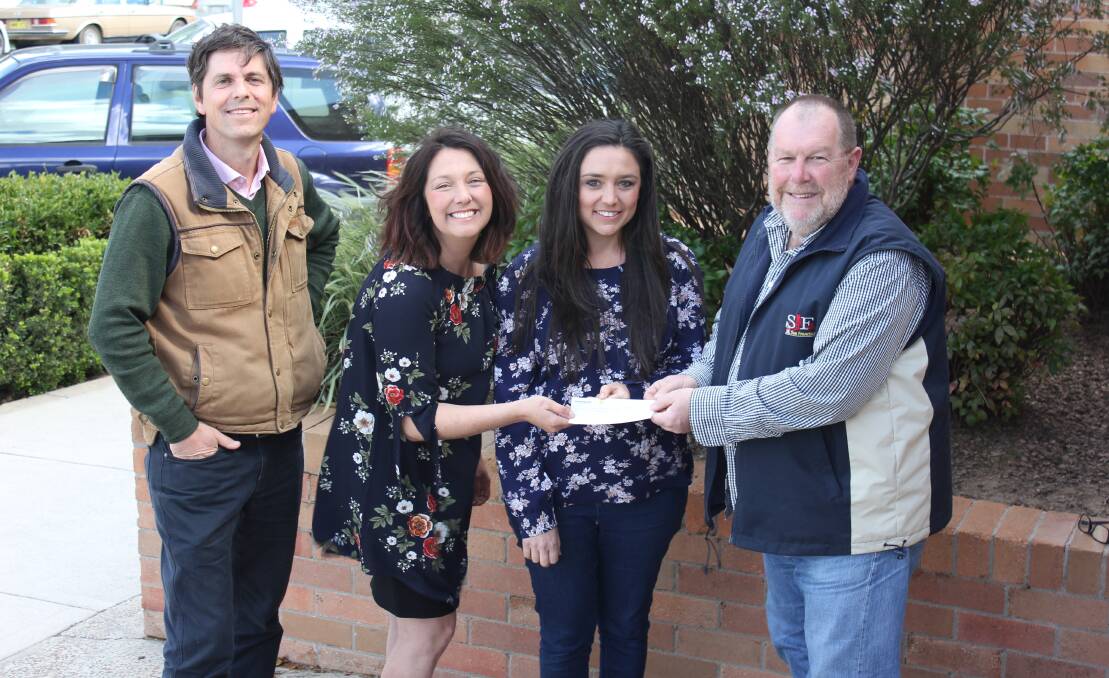 FUNDS: Festival organising committee members David Layzell, Katie Bagnall and Jessica Robinson receive the cheque from Dungog Shire Council's Ivan Skaines.