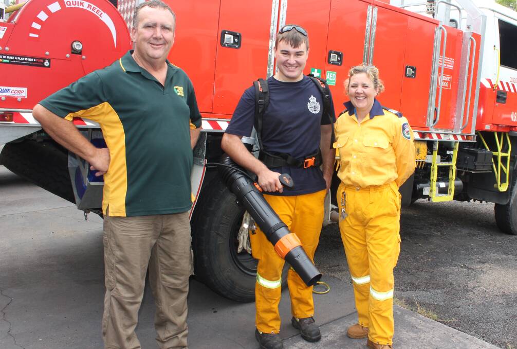 Donation: Craig Green from the Central Coast Four Wheel Drive Club with Calvin Vogele holding the new blower vac and Brigade Captain Heidi Thornton.