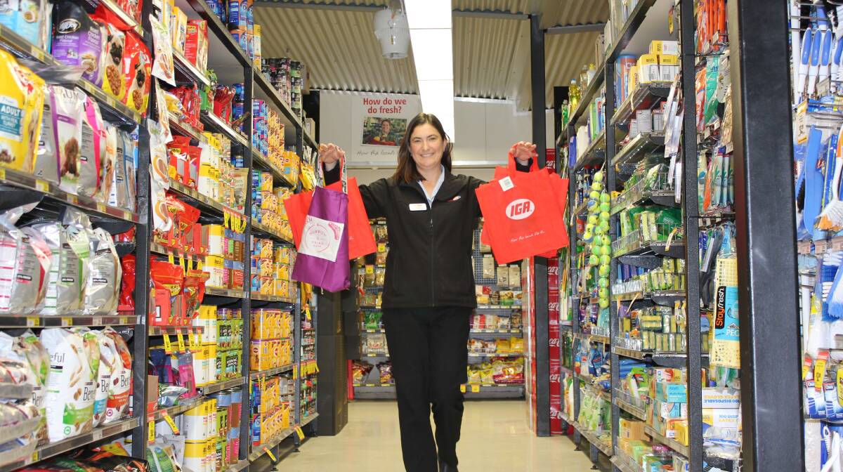 CHANGE: Lovey's Supa  IGA Dungog Store Manager Carolyn Andrews with some alternatives to plastic bags.