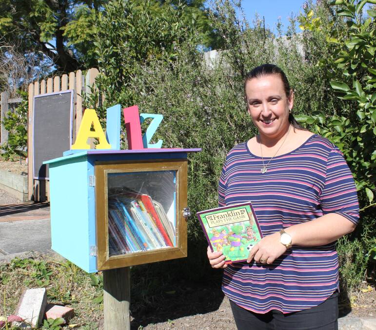 Dungog Shire Community Centre's Community Development officer Karyn Marsh with the reading box.