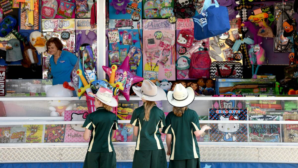 DREAMS COME TRUE: Kids attending the show line  up for a look  at the showbag stall.