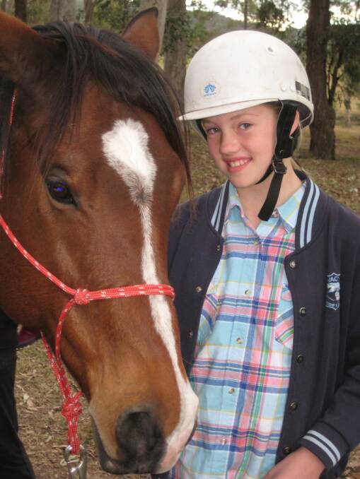 AWARD: Kacia Rowles pictured with Nitro at the Horse Tails program which helped her learn about natural horsemanship.  