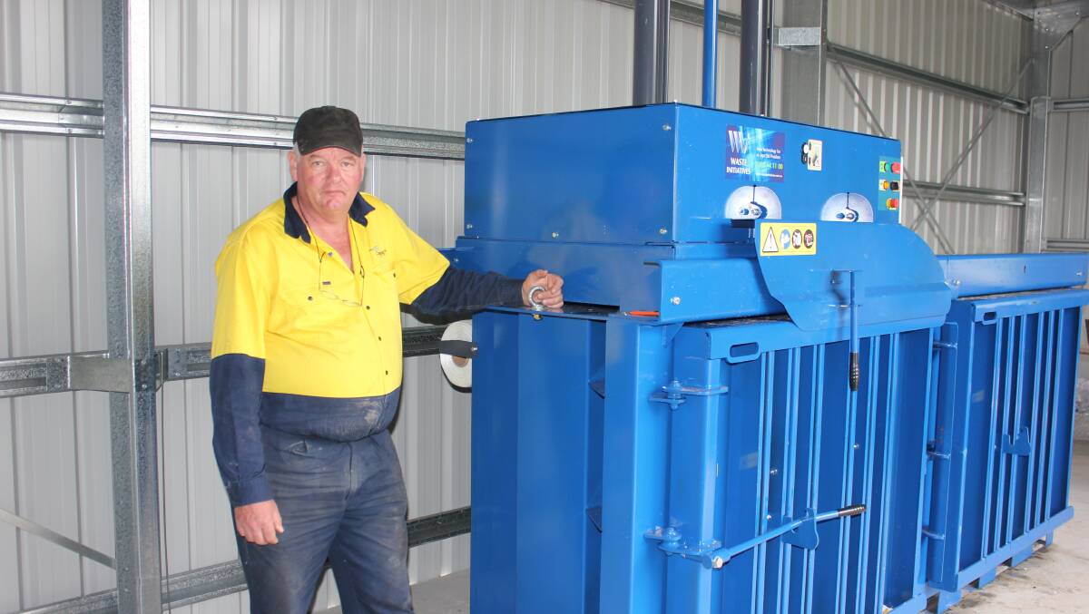 INTO THE FUTURE: John Gore and the baler at the Dungog waste facility.