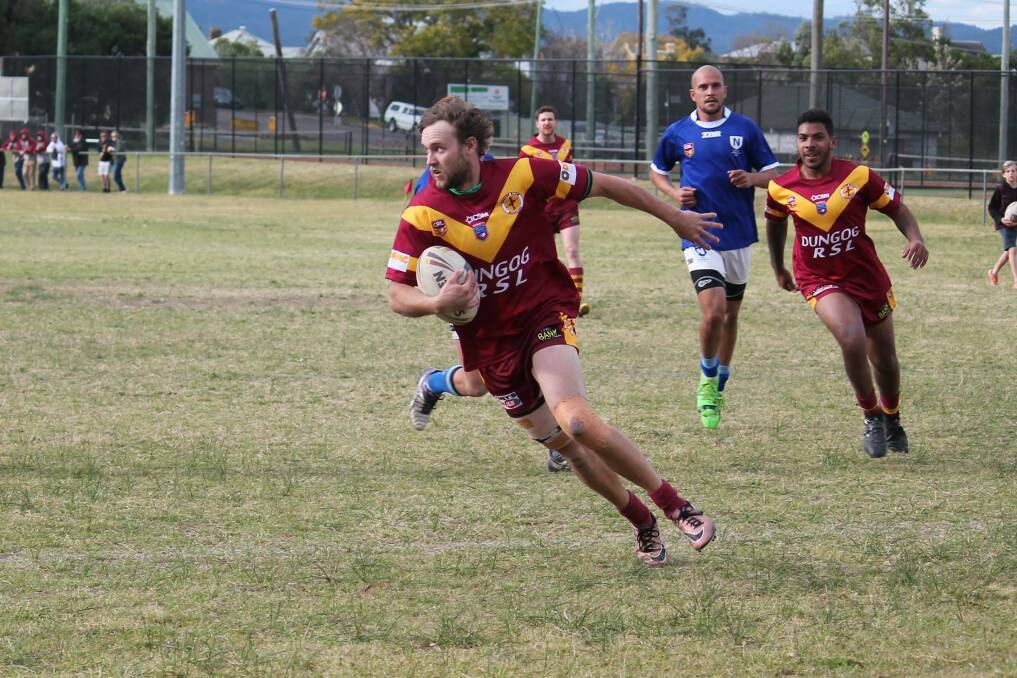 Winners: The Dungog Warriors' Jackson Bell dashes over for a try. Dungog will play Belmont South next week. Photo: Jeanie Briggs. 