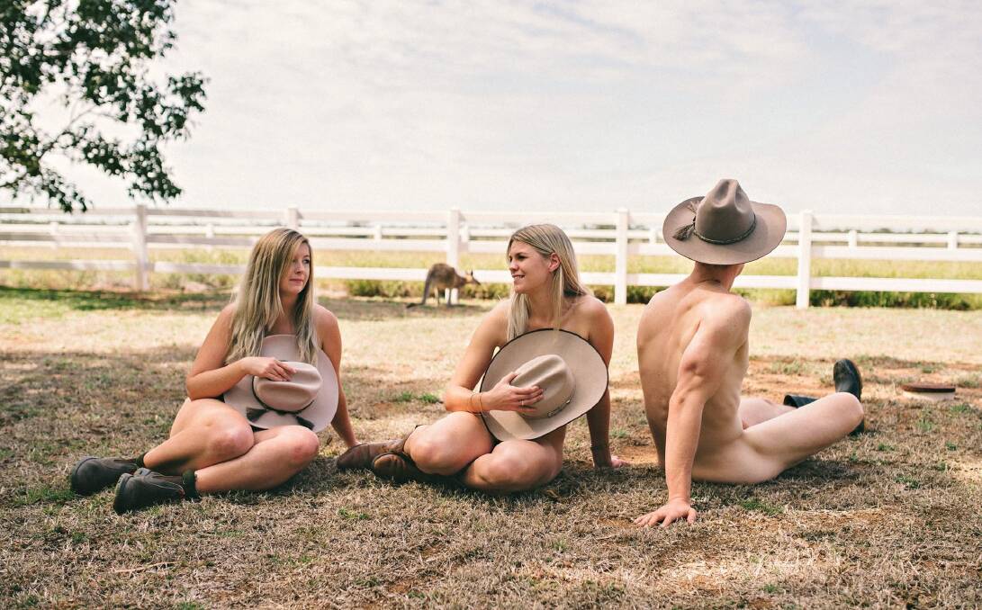  NICE VIEW: Vet students (Benjamin Reynolds on the right) look out over rural Australia for the Vets Uncovered calendar. Picture:  Vicki Miller Photography