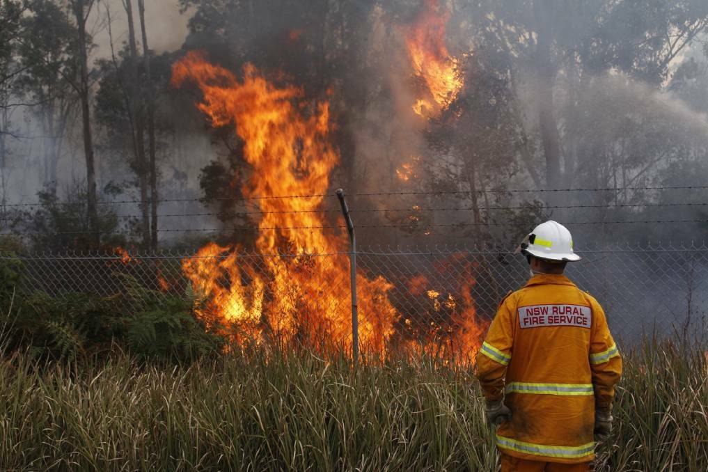 INFERNO: A firefighter on the scene at a blaze near Kurri Kurri last month. Picture: MJF Productions 