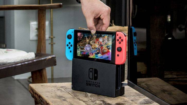 Moving from portable to home console and back again is as easy as dropping the Switfch into its dock, or lifting it out. Photo: Nintendo