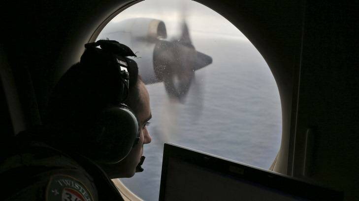 Flight officer Rayan Gharazeddine on board a Royal Australian Air Force Orion searches for the missing Malaysia Airlines flight in southern Indian Ocean, in 2014. Photo: AP/File