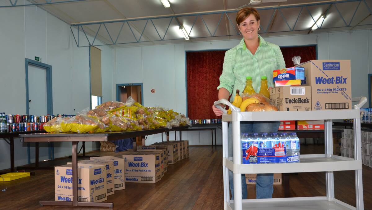 Karen Sowter with the large array of food items for those in need. Pic: Janelle O'Neill