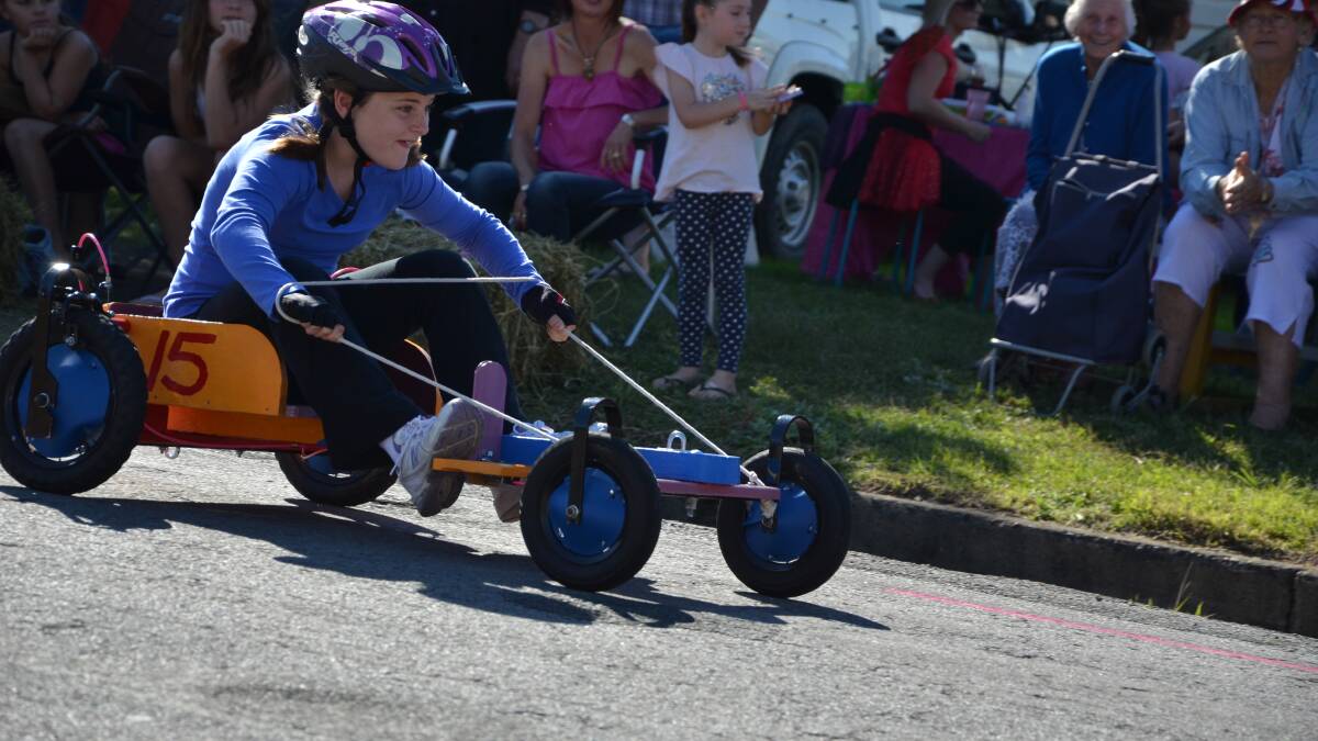 Yolanda Atchison reaches the finish line in  the billy cart derby held in Gresford on Saturday