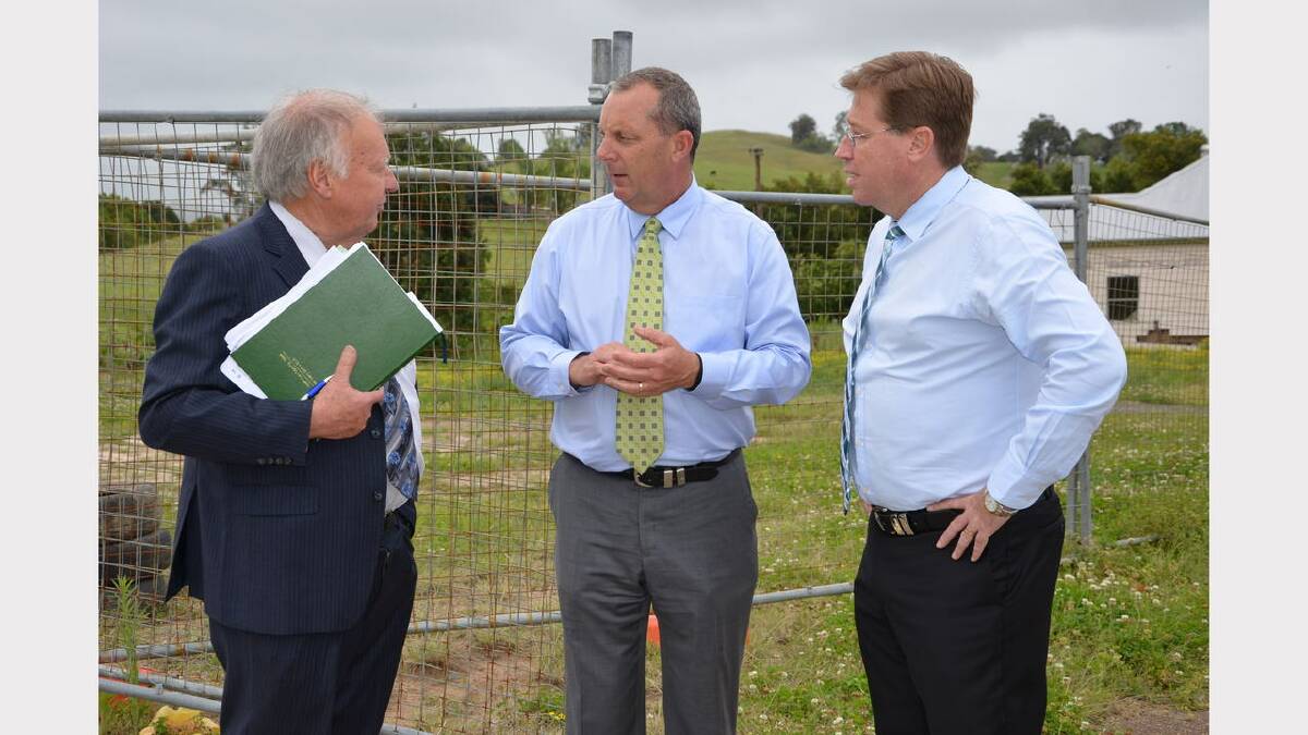 Dungog mayor Harold Johnston briefing Member for Upper Hunter Michael Johnsen and Deputy Premier and NSW Police Minister Troy Grant about progress from the April superstorm