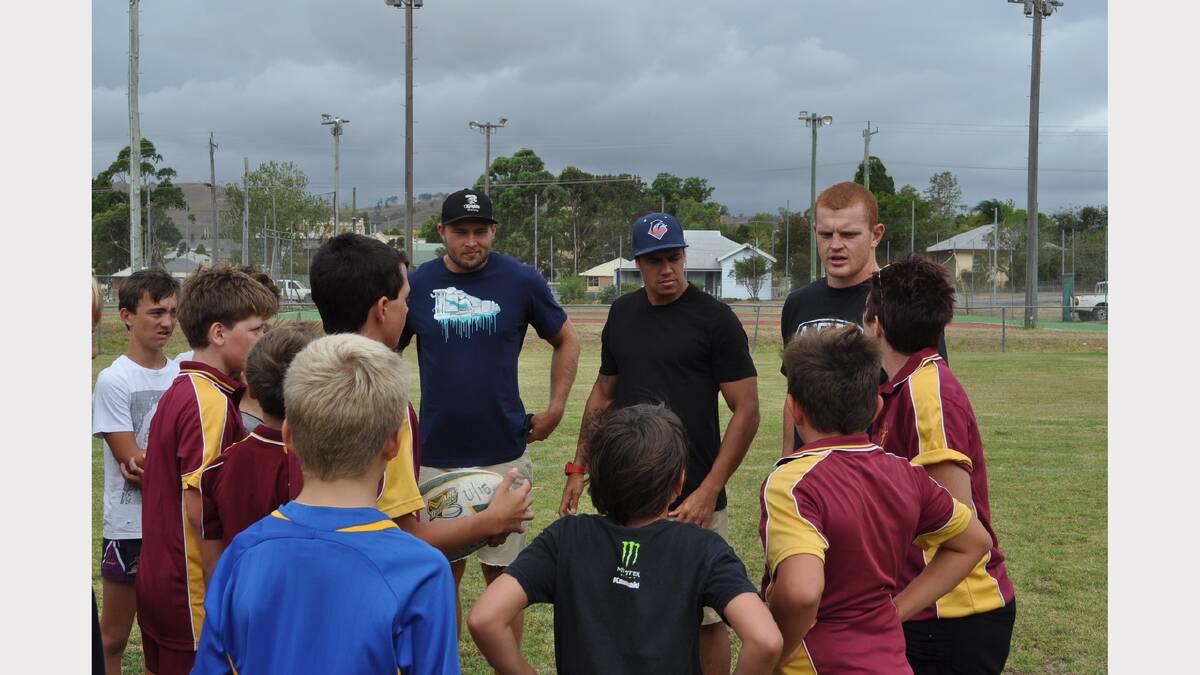 Newcastle Knights players Robbie Rochow, Dane Gagai and Alex McKinnon on their visit to Dungog in February last year with a group of Dungog Junior Rugby League players.