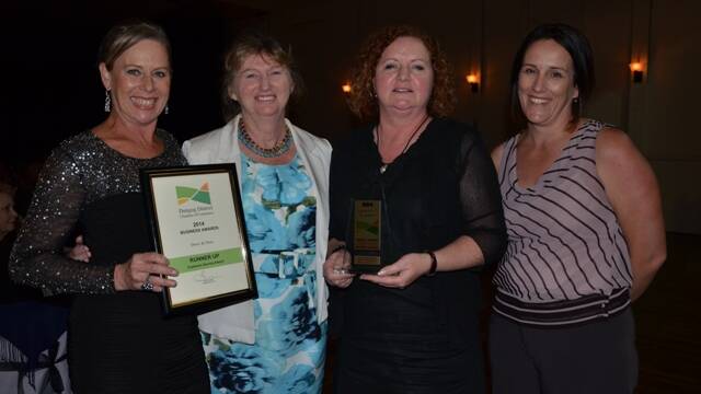 Dungog chamber president Jenny Lewis and Kate Murphy with winners of the Customer Service Award Anne Robards and Barb Turner representing Williams Valley Pharmacy.