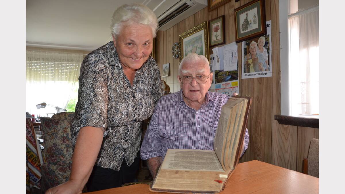 Sue Flannery and caretaker of her grandfather's war memorabilia Trevor Brooker and the Dutch bible