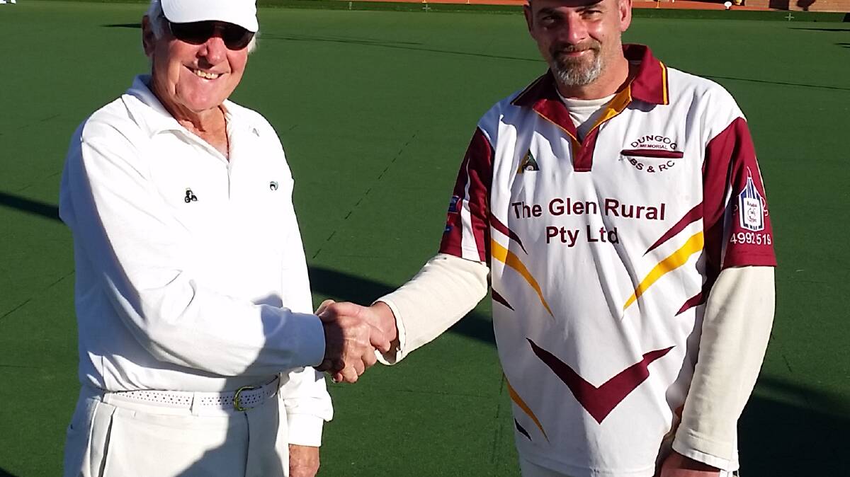 Ken Russell congratulating Jon Martin on his win in the singles competition at Dungog Bowling Club