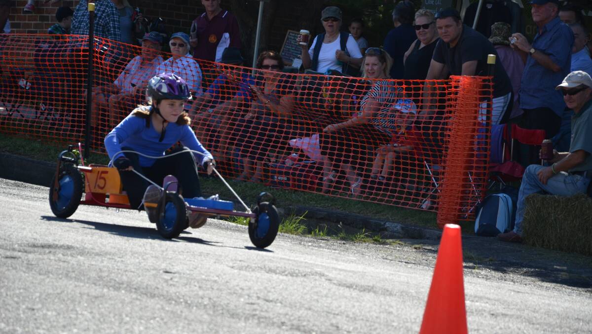 Yolanda Atchison steers her cart to the finish line at the billy cart derby held in Gresford on Saturday
