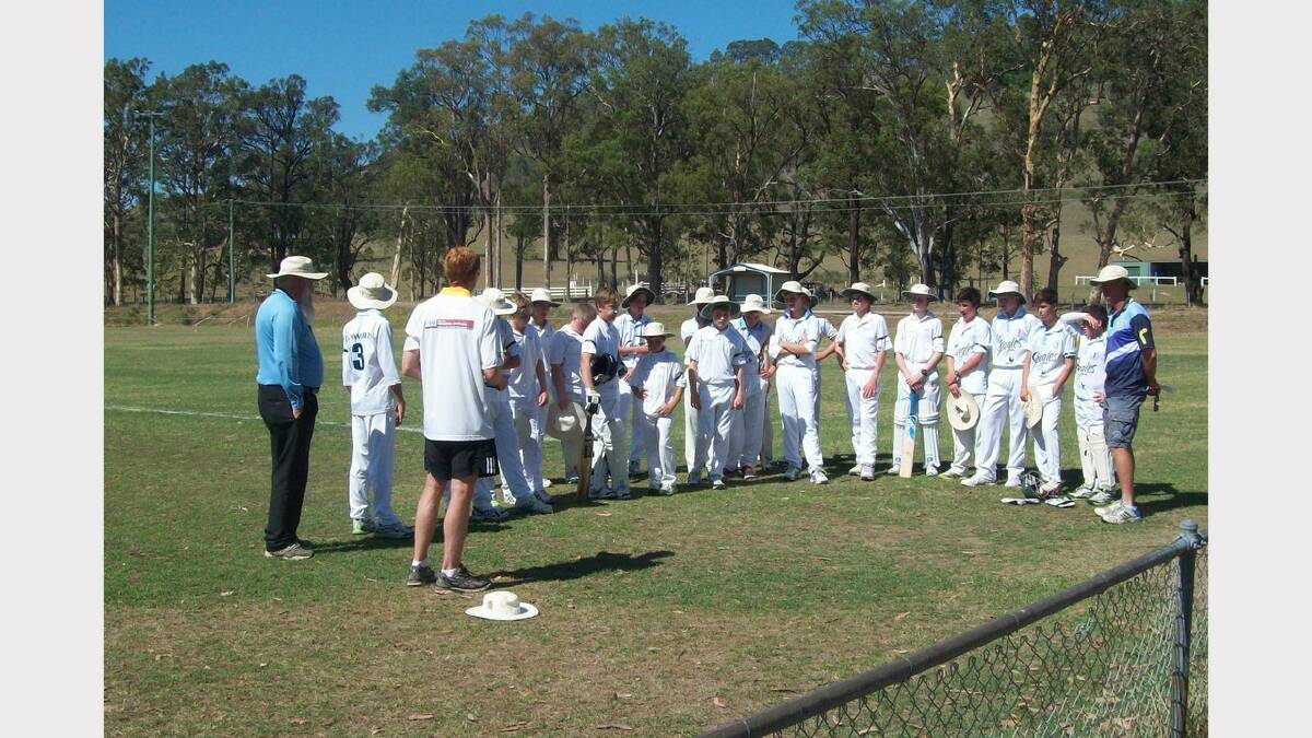 Under 14s Dungog and Tamworth rep cricket teams at Gresford Sporting Complex on Sunday. Dungog coach Tony Fort and umpire Graham Hudson spoke before the minute's silence.