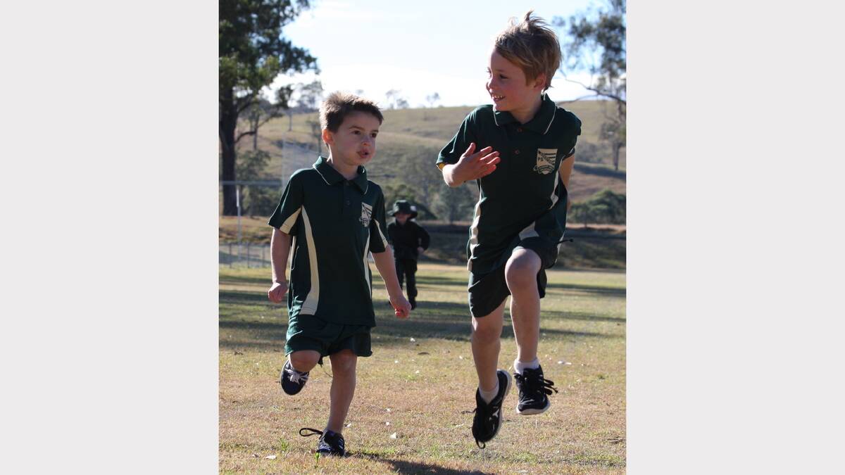 Kindergarten students Chase Hoffman and Jaxon O'Connor cross the line in the 70m sprint.