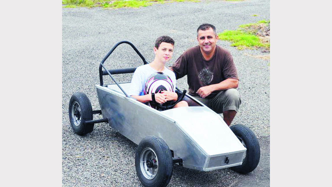 Oliver Rampling with his Dad Jason and their revamped billycart they will be racing down Park Street, East Gresford, on Saturday