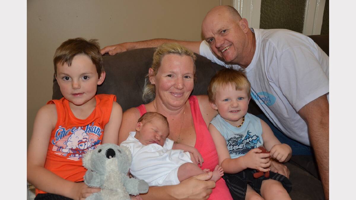 Fiona Walters and Shane Darr with newborn son Oscar and big brothers Jacob (on left) and Charlie.
