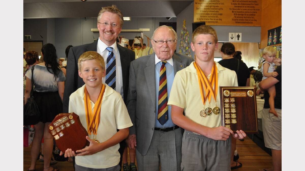 Arthur Morris attended Dungog Public School's presentation day in December 2013.  He is pictured with principal Steven Richard and sporting students Liam Kennedy and Wyll Darr.