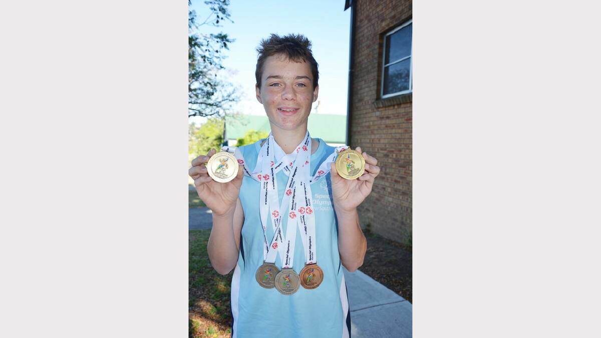 Lleyton Lloyd with his swag of medals from the Special Olympics Australia National Games held recently.