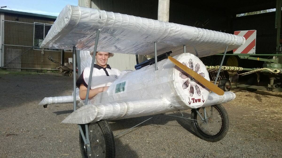Tom Wright Jnr in the first aeroplane billy cart to race down Park Street in East Gresford on Easter Saturday for the annual billy cart derby