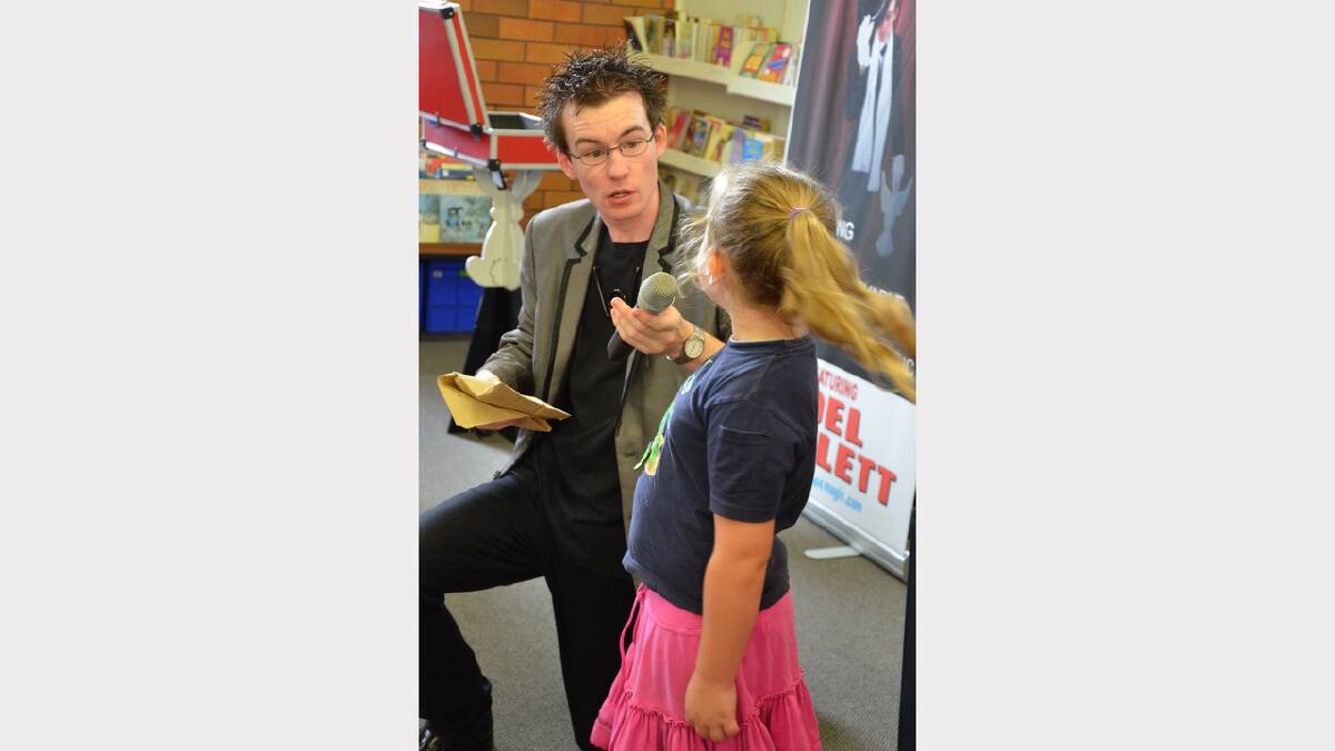 Magician Joel Howlett with young Grace performing at Dungog Library on Wednesday