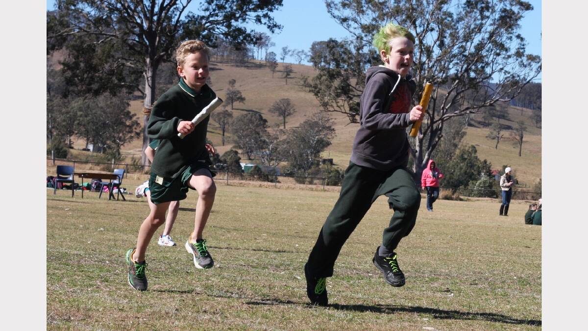 Jack Hodges, right, and Hamish Jupp play their part in the relay.
