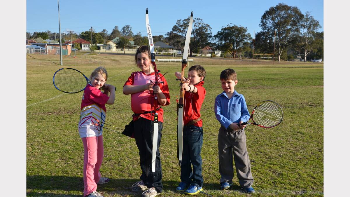 Emily Gibson and (right) Bailey Gulliver enjoy tennis while Rose and Patrick McInnes are keen archers.  Both sports will be available at the festival of sport to be held during the October school holidays.