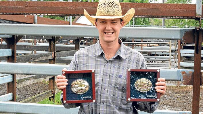 Ben Maytom with two of his prized buckles.