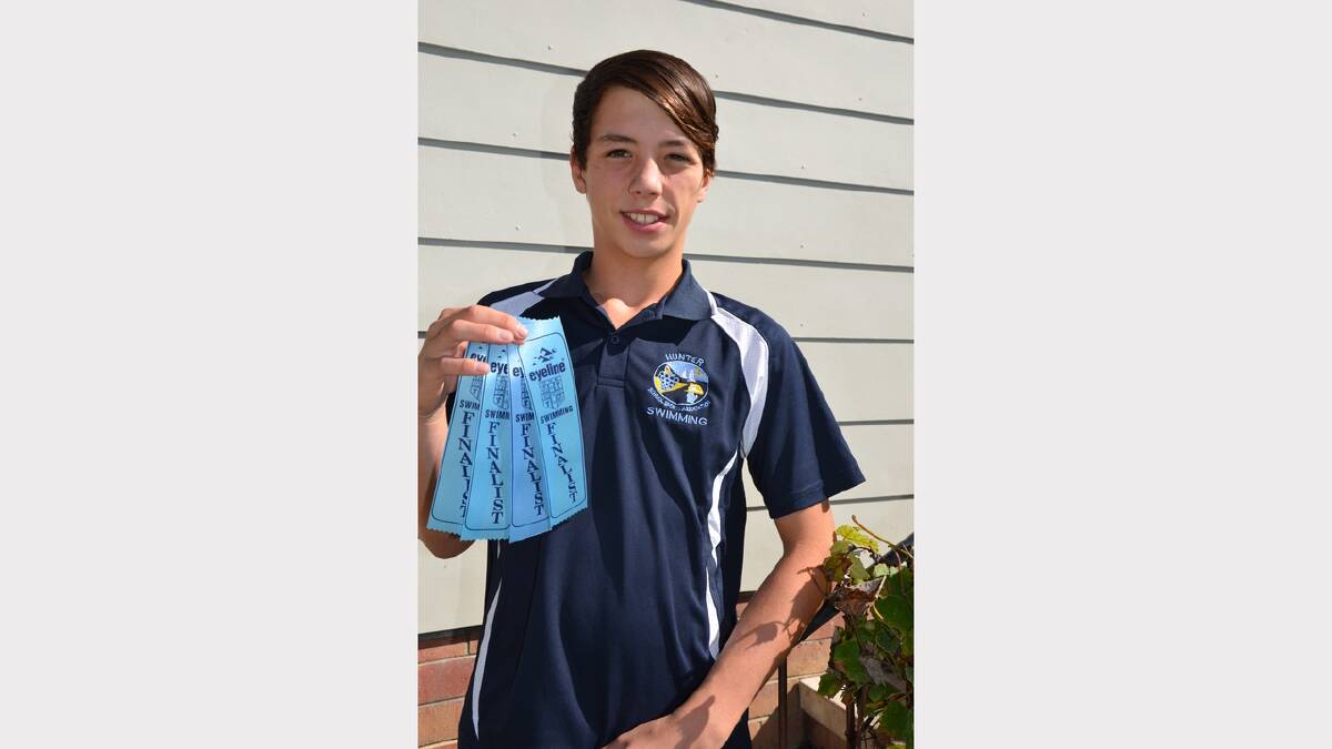 Broc Hunt with his ribbons from the state swimming carnival held at Homebush earlier in the month.
