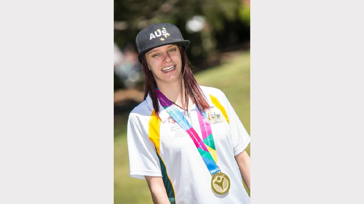 Melissa Nelson proudly wearing her gold medal from the Special Olympic World Summer Games