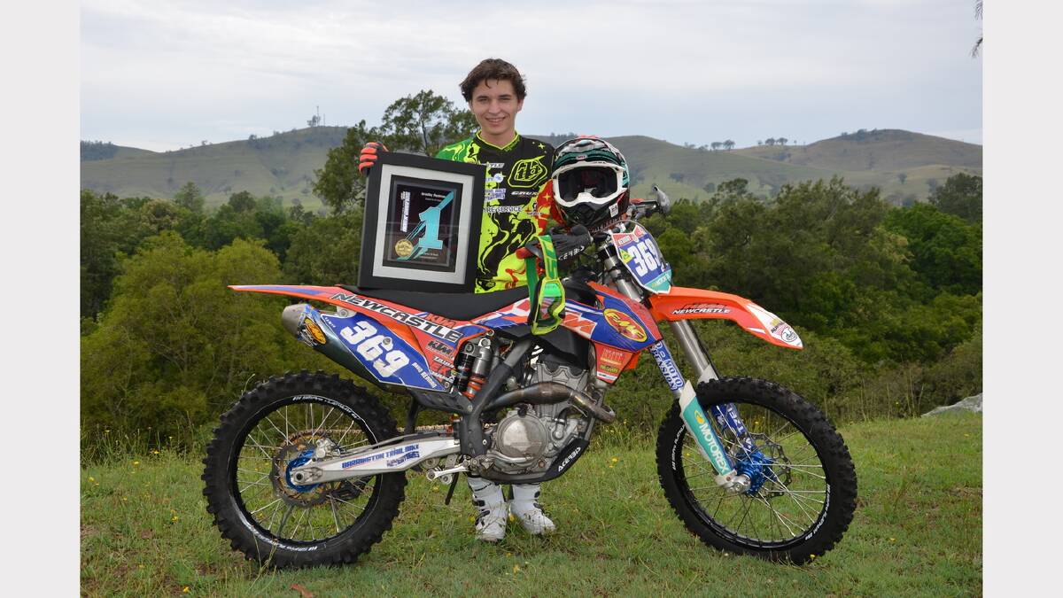 Brad Redman with his KTM 350 and his championship award