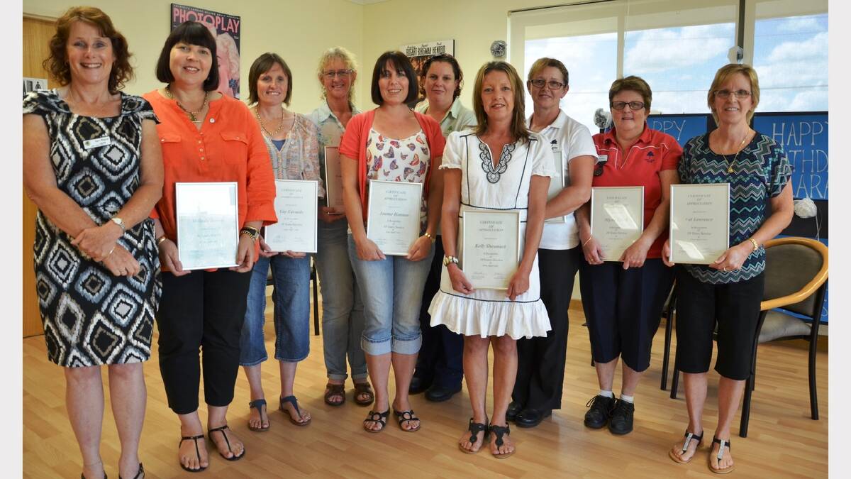 Lara manager Kerri Wagner with recipients of certificates for 10 years of service – Melinda Bowen, Gay Edwards, Leanne Stedman, Megan Hunt, Kim Miners, Myree Lynch, Val Lawrence; front, Joanne Hannan and Kelly Sheumach. 