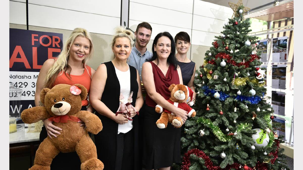 Lisa Coburn, Natasha McElwaine, Liam Murphy, Kristy Chase and Sarah U’Brien at McElwaines with the Giving Tree. Photo by Perry Duffin