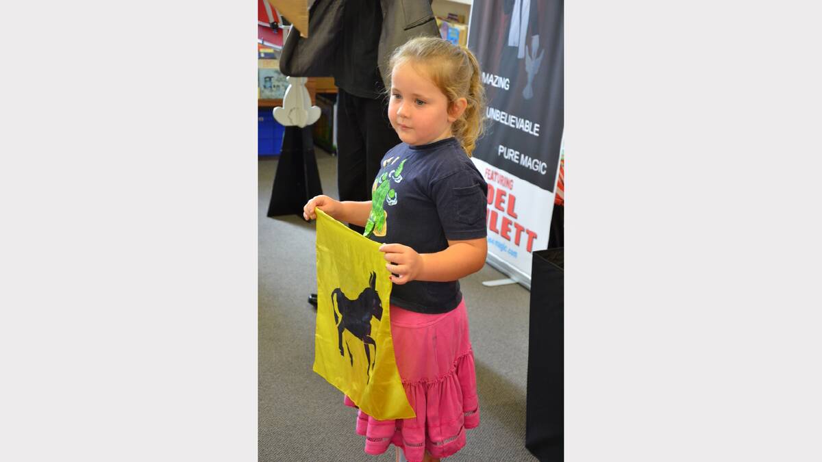 Young Grace performing with magician Joel Howlett  at Dungog Library on Wednesday