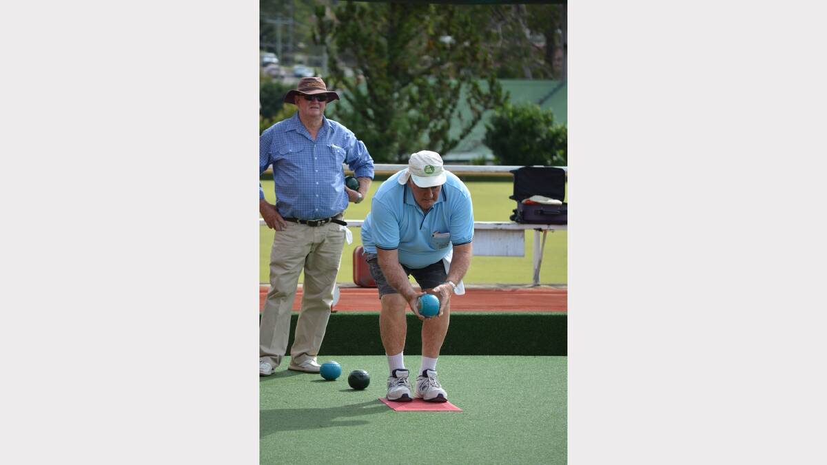 John McDonald watches as Kevin Maley is ready to bowl