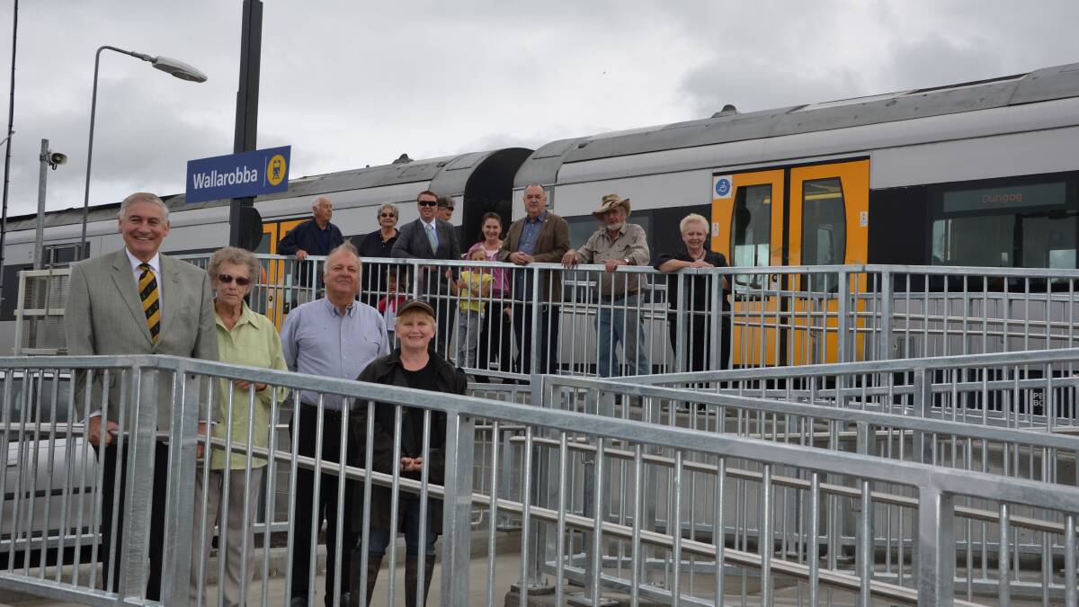 State Member for Upper Hunter George Souris with Ruth Arnall, Dungog mayor Harold Johnston and Louise Rowley with other Wallarobba residents at the rear of the new platform.