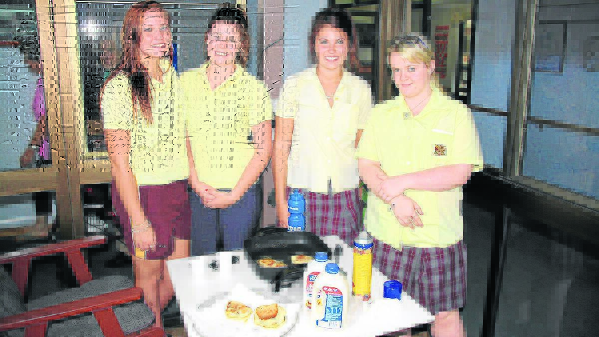  DHS students cooking pikelets for Lara Aged Care residents (from left) Alyssa Pustolla, Chloe Tanner, Maddison Brown and Shenaye Latham.