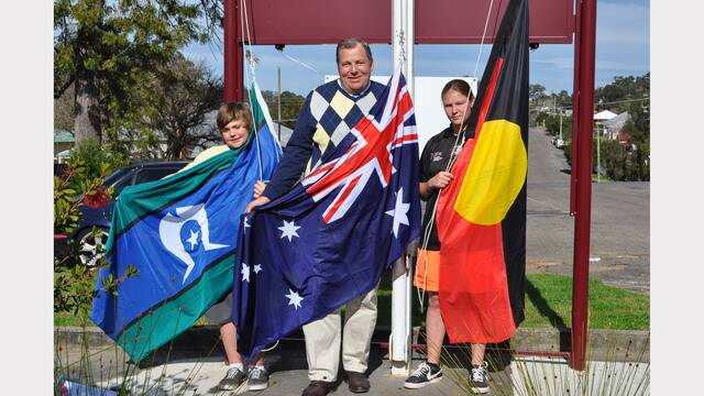 Rachael Somerville and Sam Russell with Federal  Member for Paterson Bob Baldwin who presented the school with new flags. The year 8 students have been raising and lowering the flags every day since they started at the school last year.
