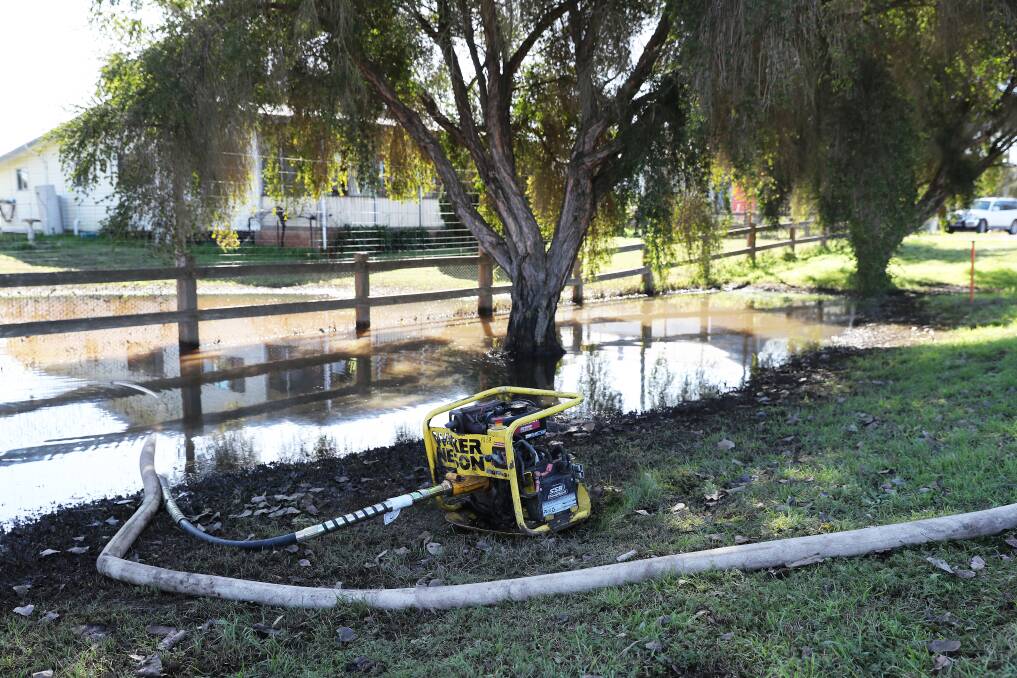 Missing pump: Water pump set up by Bulga Coal out the front of Michael Wilson's home in late July. Picture: Peter Lorimer