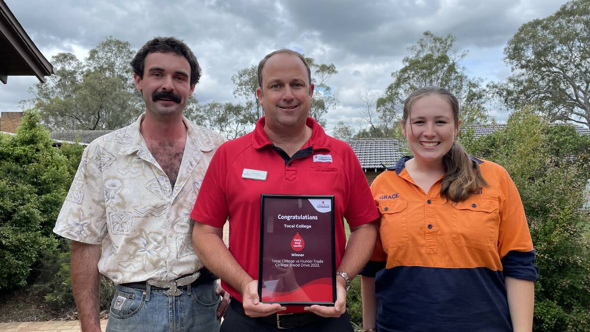 Tocal College blood donors Jesse Emery and Grace Nesbitt with Lifeblood spokesperson Brian Bruce, who presented the college with a certificate on Thursday, November 23. Picture by Chloe Coleman