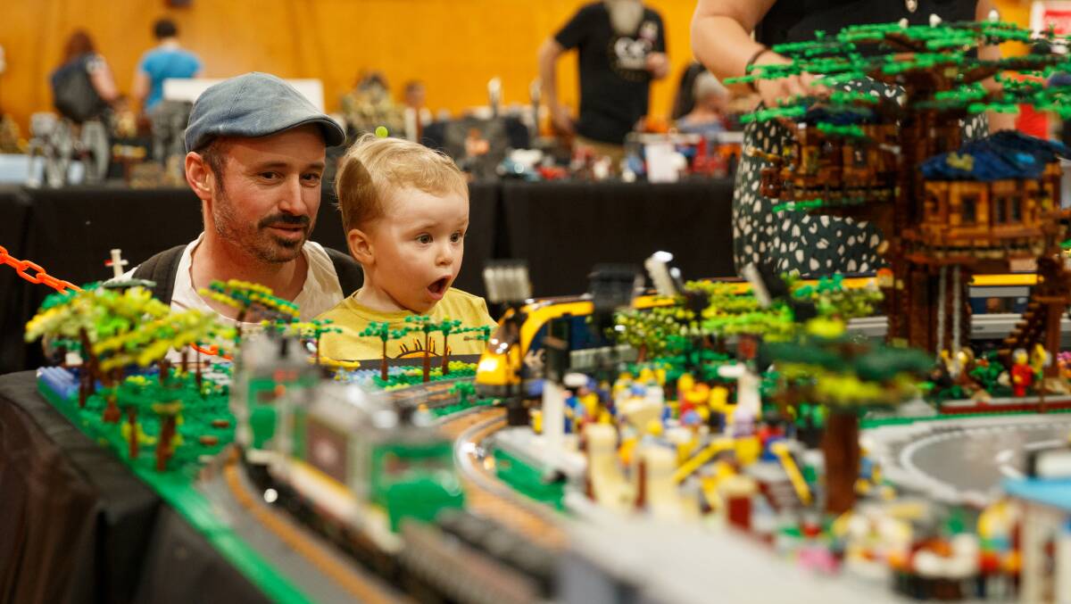 Richard Hershman of Horseshoe Bend and two-year-old son Toby Hershman enjoying Maitland Brickfest at Maitland High School in 2019. Picture by Max Mason-Hubers