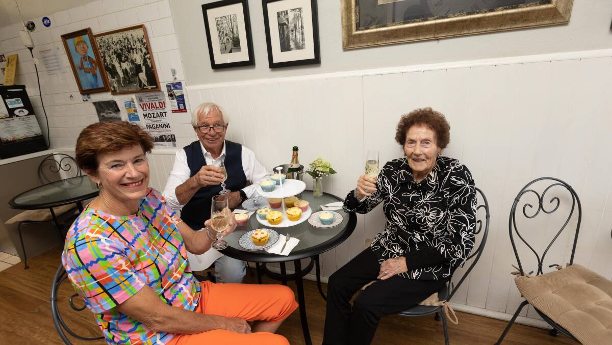 Melinda Thompson, Brian Burke and Joan Palmer celebrating their birthdays with a glass of champagne at Burkey's House of Espresso. Picture by Jonathan Carroll
