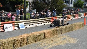 Darryn Turner racing his coffin cart. Picture by Angus Michie