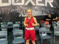 Shelby-Lee Wintle poses for a traditional boxing photo with her gold medal proudly hanging around her neck. Picture supplied
