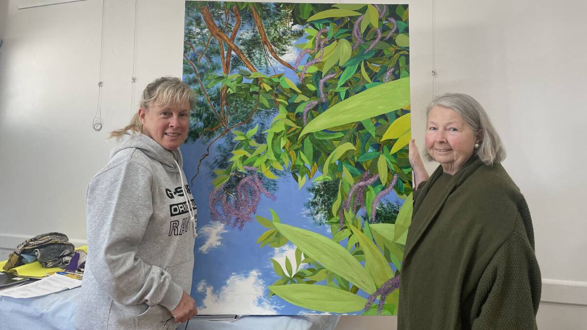 ART: Featured artist Sue Strickland (left) with the Dungog and Clarence Town CWA president Julie Fitzgerald. Picture: Angus Michie