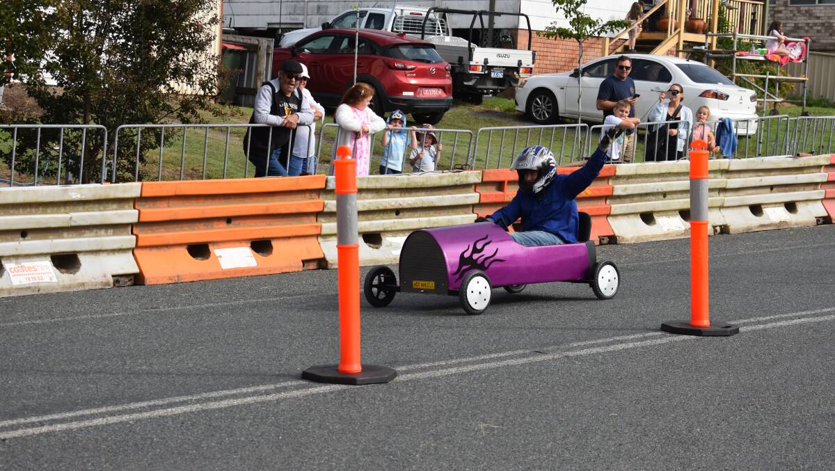 An enthusiastic driver waving at the crowd during the Gresford Billy Cart Derby. Picture by Angus Michie.
